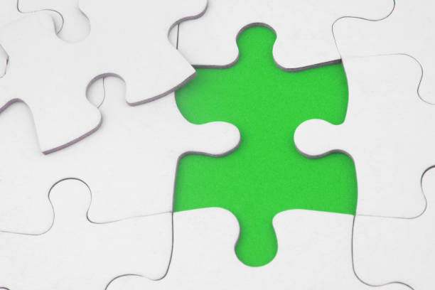 istock White jigsaw puzzles background, one piece disconnected and ready to connect. 1362660926
