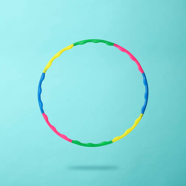 istock Rainbow hula hoop floating in mid-air against light blue background 1362660960