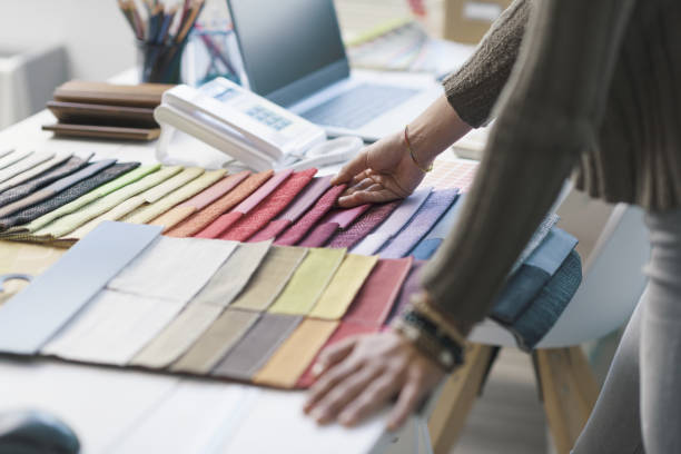 istock Professional decorator choosing fabric swatches 1362661149