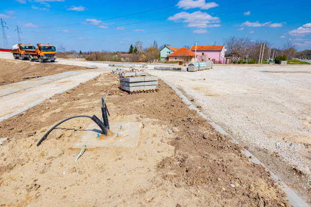 istock Corrugated pipe with cable coming out from the ground. 1362666929
