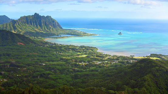 Aerial view of Kualoa mountains and Mokoli’i island in Kaneohe Bay, Oahu, Hawaii Islands, USA.