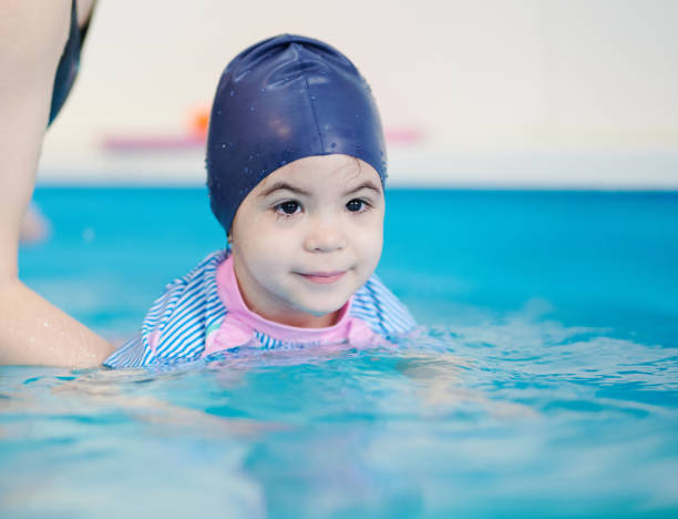 istock Child portrait in swimming pool 1362668004