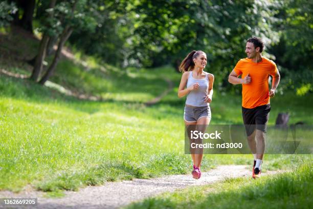 Portrait Of Happy Fit People Running Together Ourdoors Couple Sport Healthy Lifetsyle Concept Stock Photo - Download Image Now