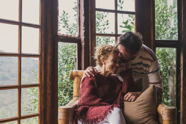 istock Cheerful Couple Embracing At Home 1362675305