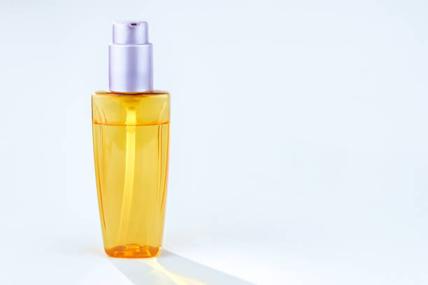 Plastic bottle with shampoo or hygienic cosmetic product, isolated on white