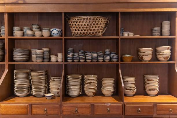 istock Kitchenware with dishware keeping on kitchen wooden shelving.Traditional Vietnamese blue porcelain with plates and bowls in Southeast Asia in Vietnam. 1362677139