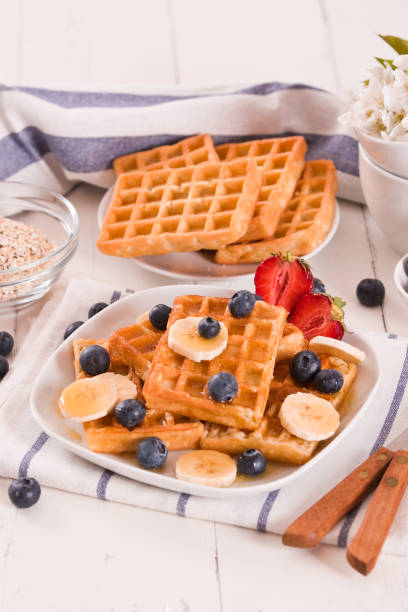 istock Waffles with blueberries, bananas and honey. 1362679942