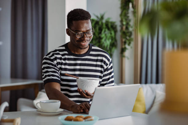 istock Young man having a breakfast in the morning 1362680009