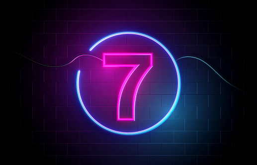 Number 7 neon sign illuminated with blue and purple lights. Marketing And Consumerism Concept.