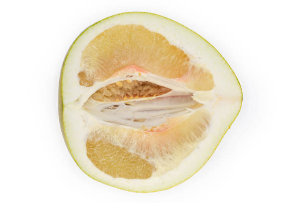 istock Lengthwise section of a pomelo fruit on a white background 1362681587