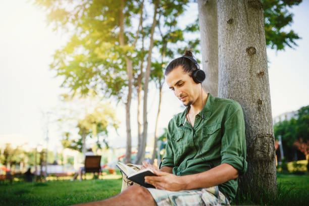 Young man learning in the park