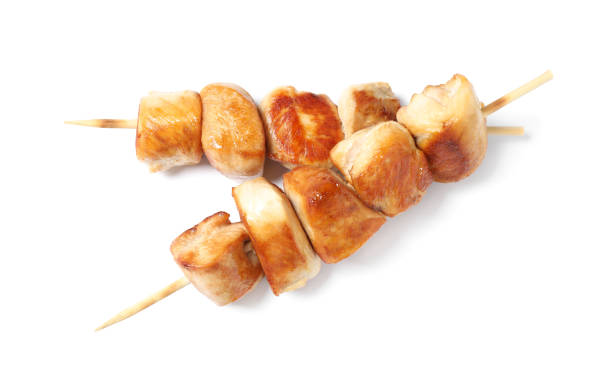 istock Delicious chicken shish kebabs on white background 1362686184