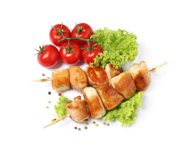 istock Delicious chicken shish kebabs and vegetables on white background, top view 1362686451