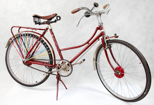 Vintage early twentieth century Dutch women's bicycle with lantern isolated on a white background