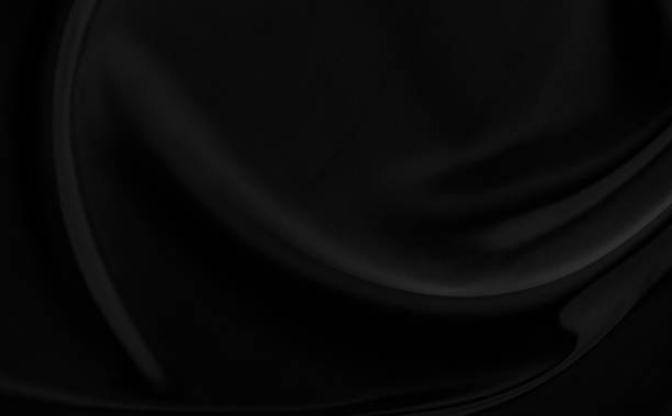 istock Black gray satin dark fabric texture luxurious shiny that is abstract silk cloth background with patterns soft waves blur beautiful. 1362687449
