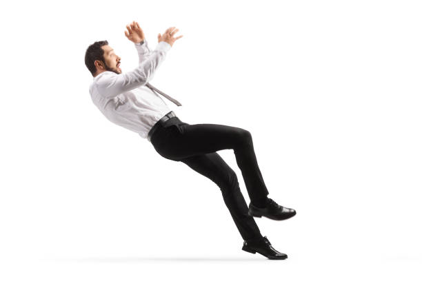 Full length side shot of a man in formal clothes falling isolated on white background