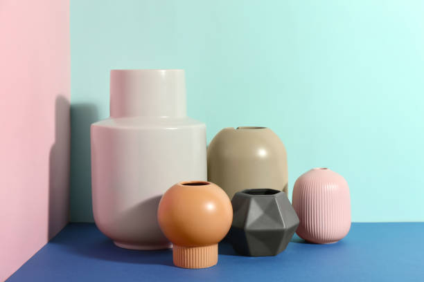 istock Stylish empty ceramic vases on color background 1362687851