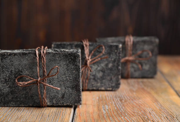 istock Natural tar soap on wooden table, closeup 1362689685