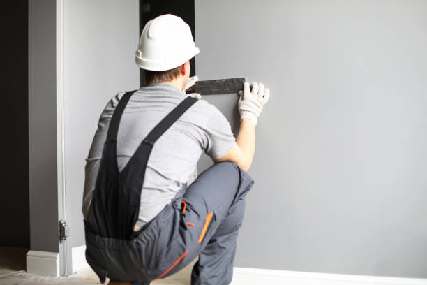 istock Repairman sitting backwards and testing combination of material colors 1362689737