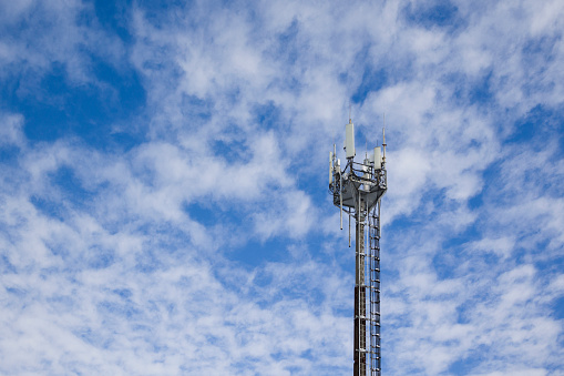 Telecommunication tower Antenna against blue sky . Copy space
