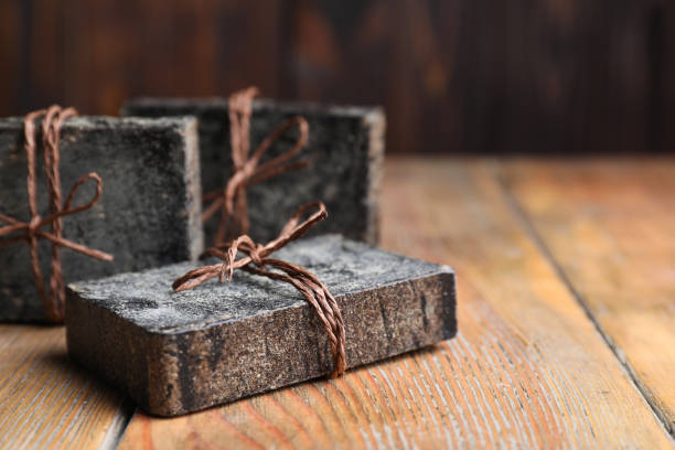 istock Natural tar soap on wooden table, closeup 1362691951