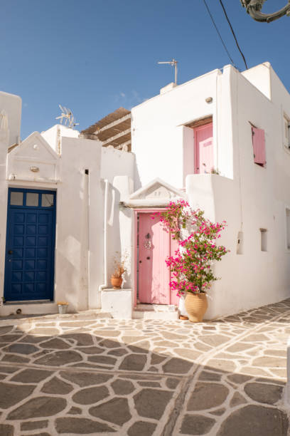 Small alley in Paros, pink door, Greece stock photo