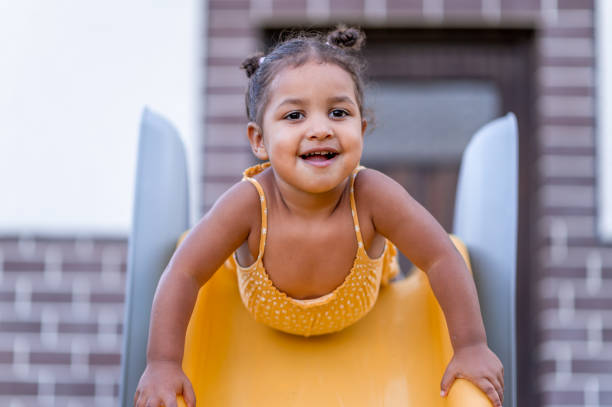 istock Little girl on a slider 1362693464