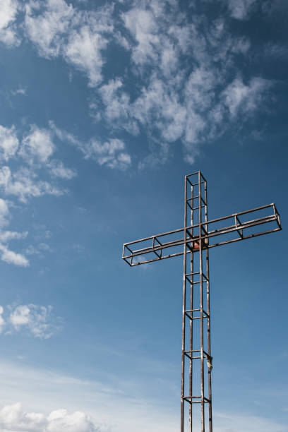 istock Metal cross with sky in the background 1362694603