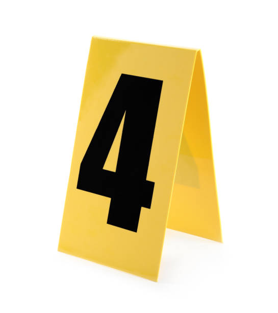 istock Yellow crime scene marker with number four on white background 1362699830