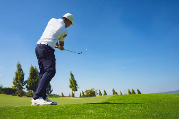 istock Asian man golfing on the course. In summer 1362700819