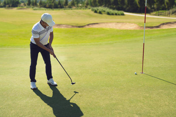istock Asian man, putt golf on green in summer 1362700852