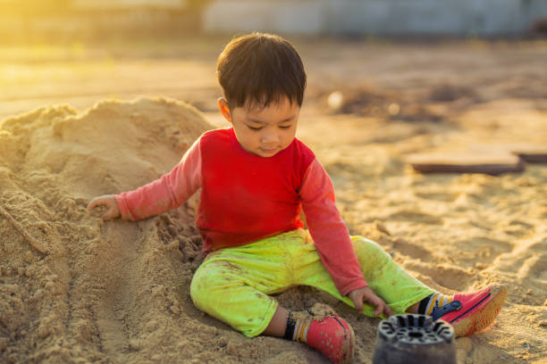 istock Young children asian sand play outdoor 1362701103