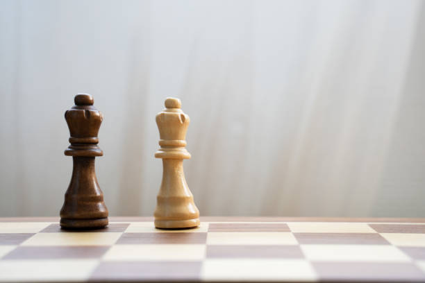 istock black and white queen on chess board 1362702703