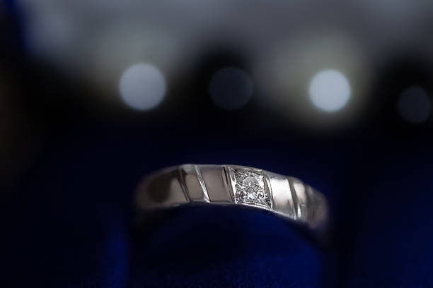 istock Diamond platinum engagement ring close up 1362702923