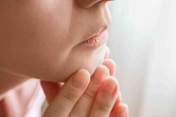 istock Woman in thoughtful pose resting face on her hands, close-up 1362702924