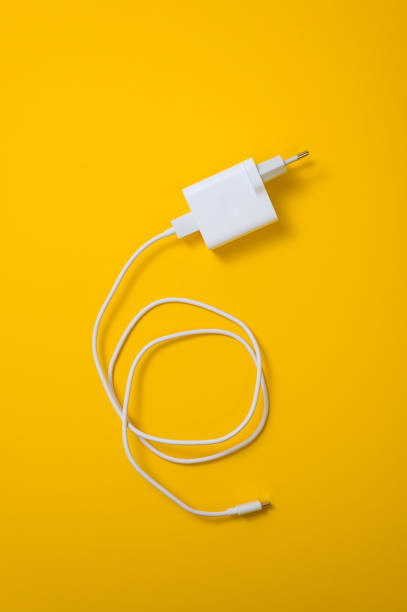 istock White micro usb type C charger for smartphone on yellow background close-up 1362704290