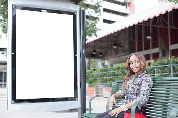 istock Woman on a bus bench 136270545