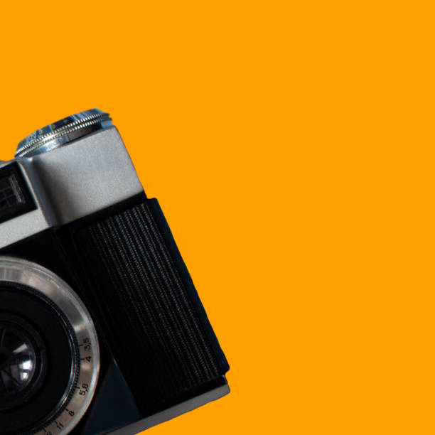 istock Vintage Retro Cameras With Copy Space on a Yellow Background. View from above. 1362707341