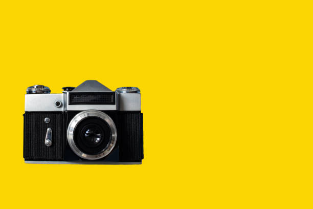 istock Close-Up of Camera Against Yellow Background. 1362707343