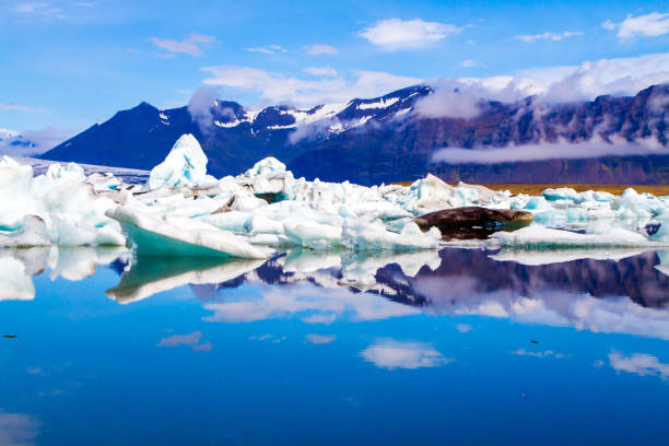 istock Icebergs and ice floes reflected in the water 1362711118