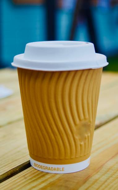 istock Hot drink in a disposable cup on a wooden table 1362715321