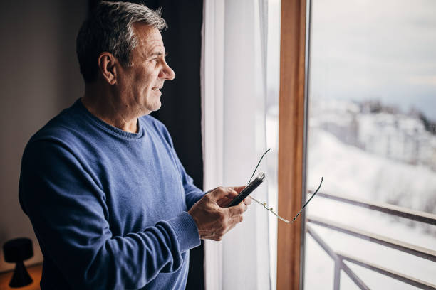 istock An older man uses a smartphone 1362715464