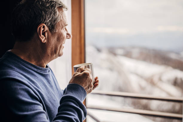 istock The man is drinking coffee looking out the window 1362715490