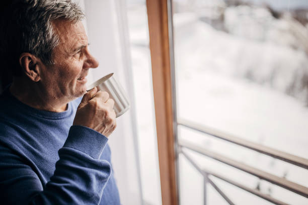 istock The man is drinking coffee looking out the window 1362715629