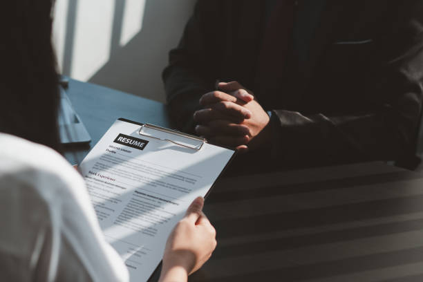 istock Executive reading a resume during a job interview and businessman Completing Application Form. Hiring concept 1362717067