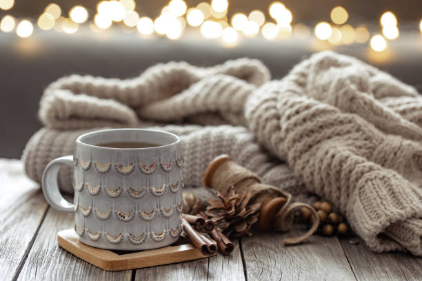 istock Beautiful christmas cup and candles on blurred background with bokeh. 1362718582