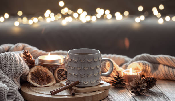 istock Beautiful christmas cup and candles on blurred background with bokeh. 1362718616