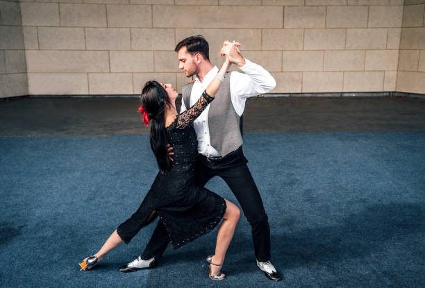 istock Man and woman dancing on stage 1362718696