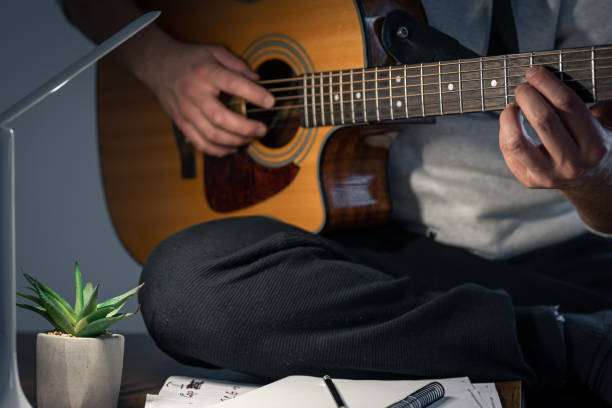 istock Working process at night, a musician is creating music at night. 1362718946
