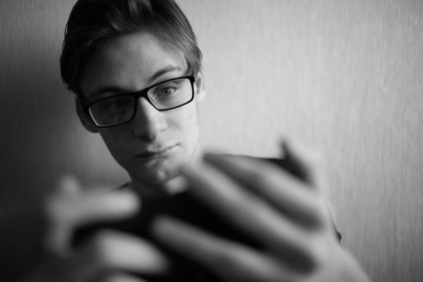 istock Young guy looks at smartphone and screams 1362718959